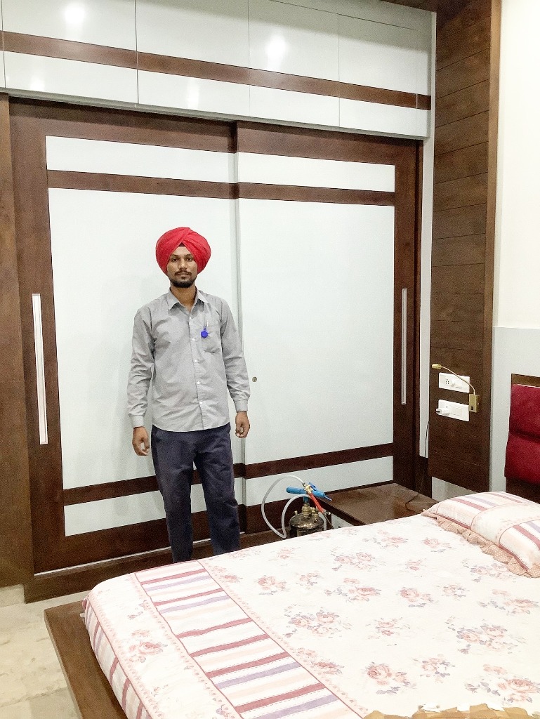 OPC technician inspecting bedroom wardrobe for termite protection
